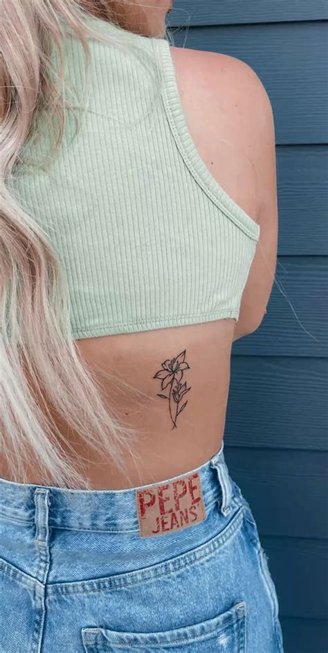 floral lower back tattoo designs|cute flower tattoo drawings.